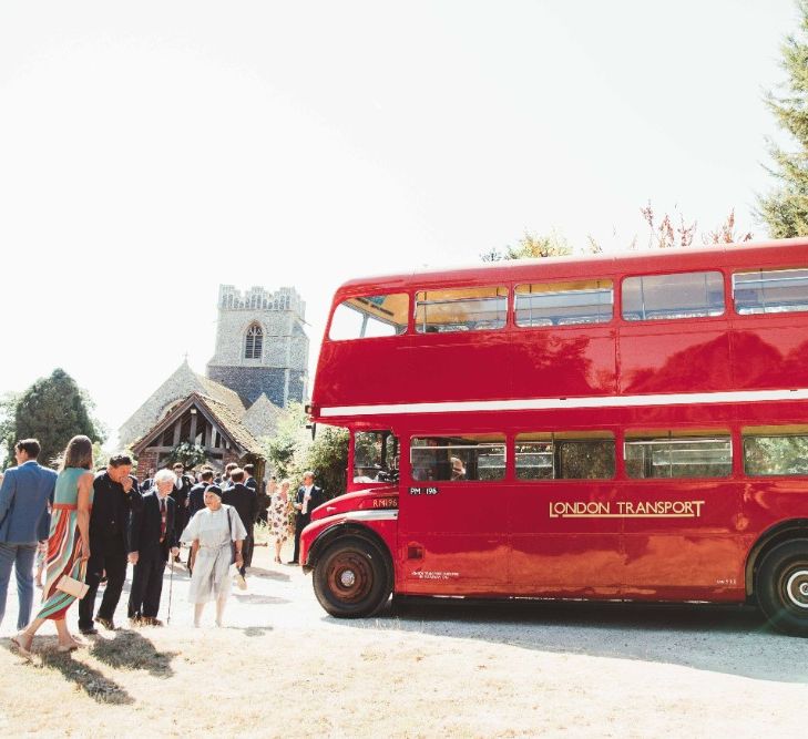 Red London Bus Wedding Transport | Quintessential English Country Wedding in Glass Marquee at Family Home | Maryanne Weddings Photography