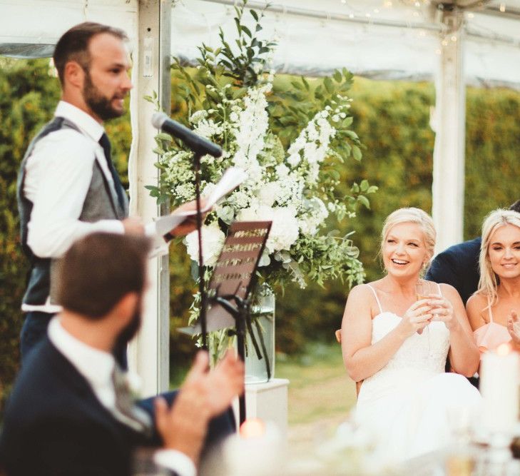 Groom's Speech | Glass Marquee with Open Sides | Bride in Essense of Australia Dress with Spaghetti Straps and Fishtail | Groom in Blue Suit with Grey Waistcoat | Quintessential English Country Wedding in Glass Marquee at Family Home | Maryanne Weddings Photography