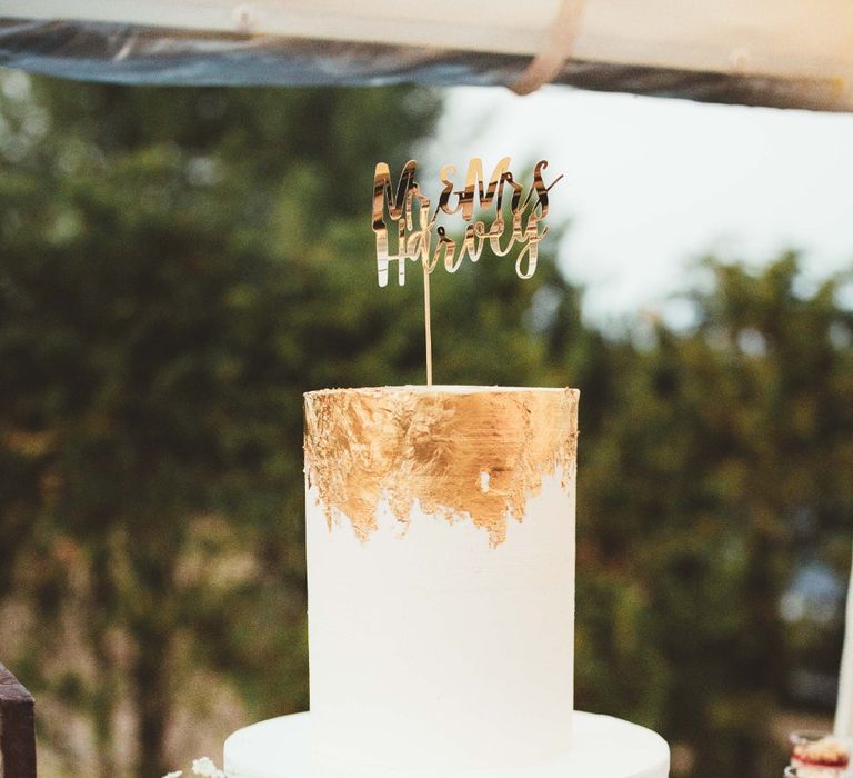 Tall One Tier Wedding Cake with Gold Leaf | Gold Mr and Mrs Cake Topper | Quintessential English Country Wedding in Glass Marquee at Family Home | Maryanne Weddings Photography