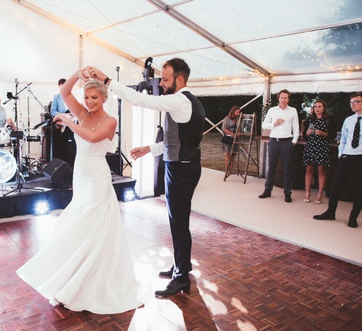 First Dance | Bride in Essense of Australia Dress with Spaghetti Straps and Fishtail | Groom in Blue Suit with Grey Waistcoat | Glass Marquee with Open Sides | Quintessential English Country Wedding in Glass Marquee at Family Home | Maryanne Weddings Photography