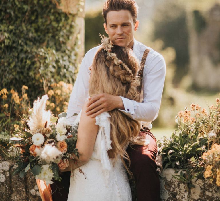 Boho Bride and Groom Embracing at Jervaulx Abbey