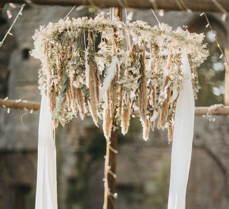 Swing Cake Table with Foliage and Dried Flower Hanging Chandelier Decor