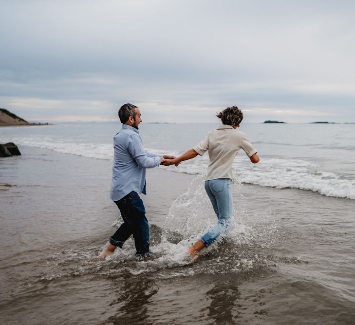 Casual beach engagement photos by LIT Photography