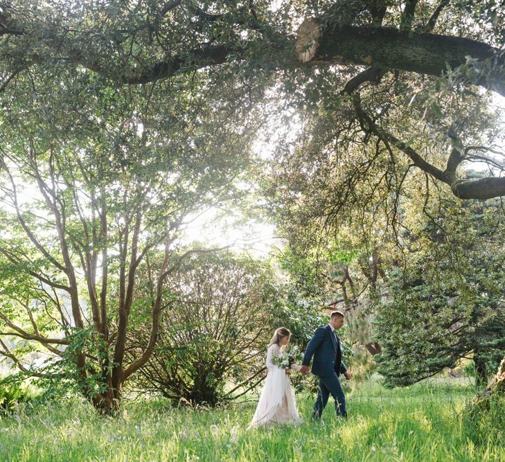 Bride in Rock The Frock Bridal Gown via The Wedding Hub | Groom in Navy Blue Wool Three Piece Suit The Vintage Suit Hire Company | Timeless English Country Garden Inspiration at Boconnoc House and Estate in Cornwall, Styled by On Serpentine Shores | Debs Alexander Photography