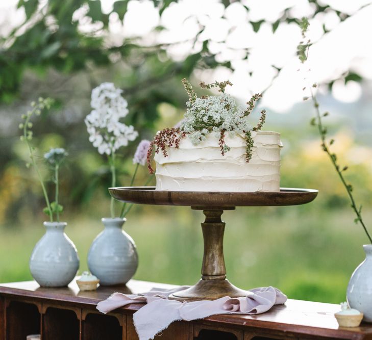 Elegant Single Tier Peboryon Wedding Cake on a Vintage Dresser | Timeless English Country Garden Inspiration at Boconnoc House and Estate in Cornwall, Styled by On Serpentine Shores | Debs Alexander Photography