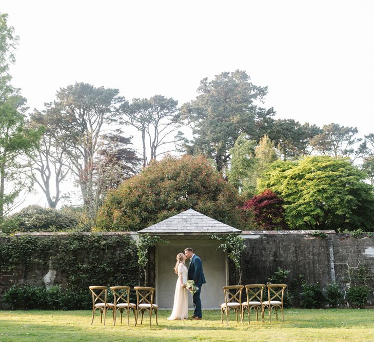 Bride in Rock The Frock Bridal Gown via The Wedding Hub | Groom in Navy Blue Wool Three Piece Suit The Vintage Suit Hire Company | Timeless English Country Garden Inspiration at Boconnoc House and Estate in Cornwall, Styled by On Serpentine Shores | Debs Alexander Photography