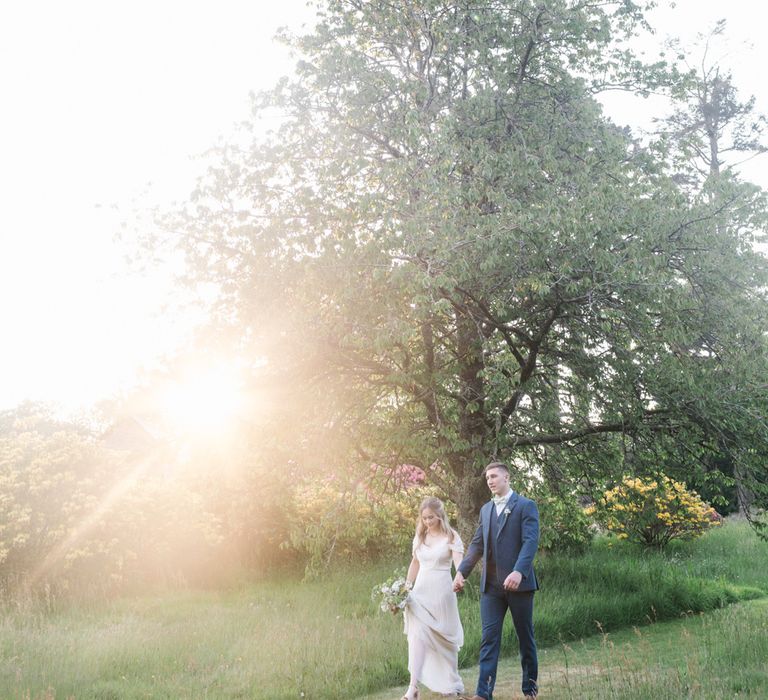 Bride in Bardot Shoulder Rock The Frock Bridal Gown via The Wedding Hub | Groom in Navy Blue Wool Three Piece Suit The Vintage Suit Hire Company | Timeless English Country Garden Inspiration at Boconnoc House and Estate in Cornwall, Styled by On Serpentine Shores | Debs Alexander Photography