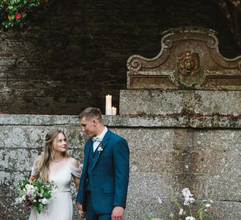 Bride in Bardot Shoulder Rock The Frock Bridal Gown via The Wedding Hub | Groom in Navy Blue Wool Three Piece Suit The Vintage Suit Hire Company | Timeless English Country Garden Inspiration at Boconnoc House and Estate in Cornwall, Styled by On Serpentine Shores | Debs Alexander Photography