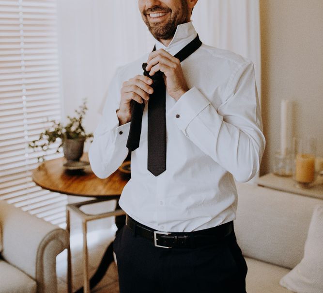 Groom Getting Ready in Hugo Boss Suit | Destination Wedding at The Modern Heirloom at Overgaauw Wine Estate in South Africa | Fiona Clair Photography