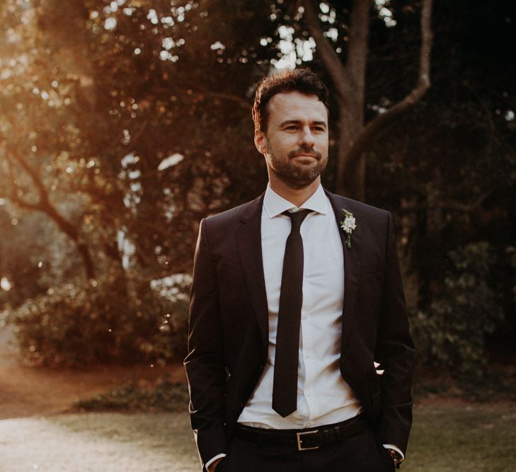 Groom in Hugo Boss Suit | Destination Wedding at The Modern Heirloom at Overgaauw Wine Estate in South Africa | Fiona Clair Photography