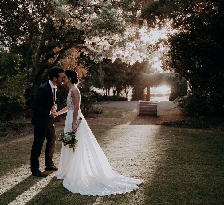 Golden Hour | Bride in Elbeth Gillis Couture Bridal Gown | Groom in Hugo Boss Suit | Destination Wedding at The Modern Heirloom at Overgaauw Wine Estate in South Africa | Fiona Clair Photography