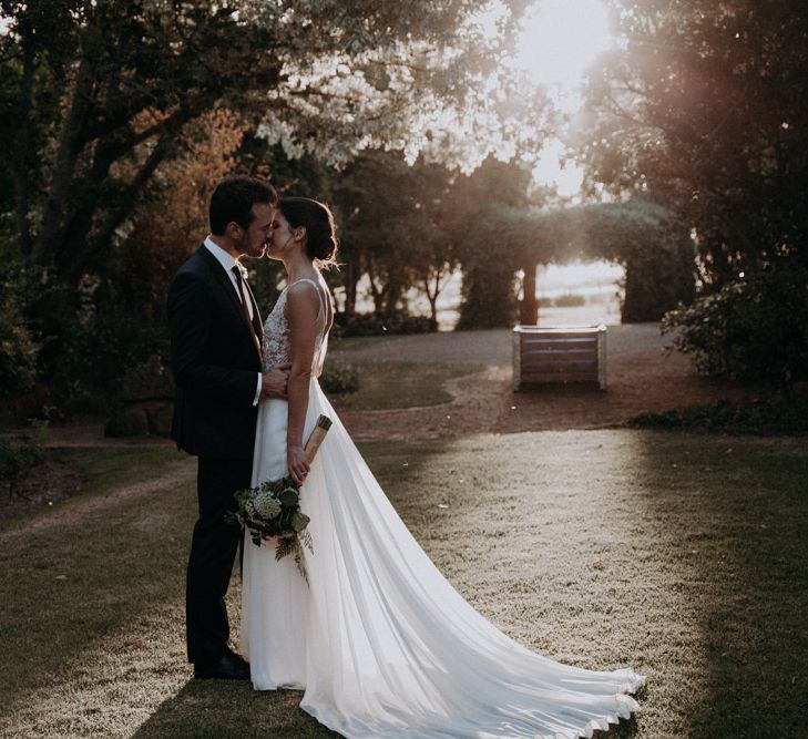 Golden Hour | Bride in Elbeth Gillis Couture Bridal Gown | Groom in Hugo Boss Suit | Destination Wedding at The Modern Heirloom at Overgaauw Wine Estate in South Africa | Fiona Clair Photography