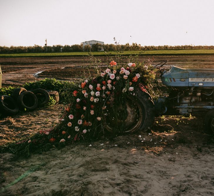 Flower covered tractor at golden wedding anniversary