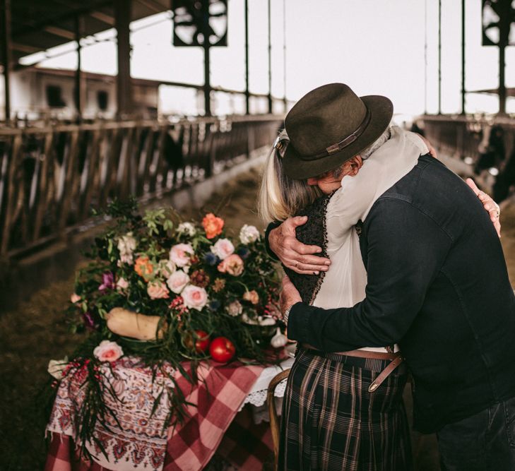 Couple embracing at vow renewal