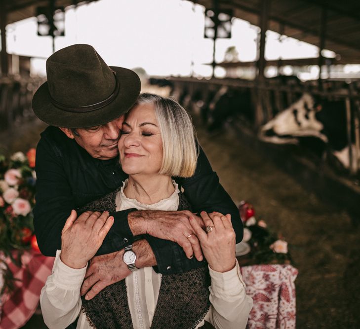 Couple embracing at golden wedding anniversary celebration