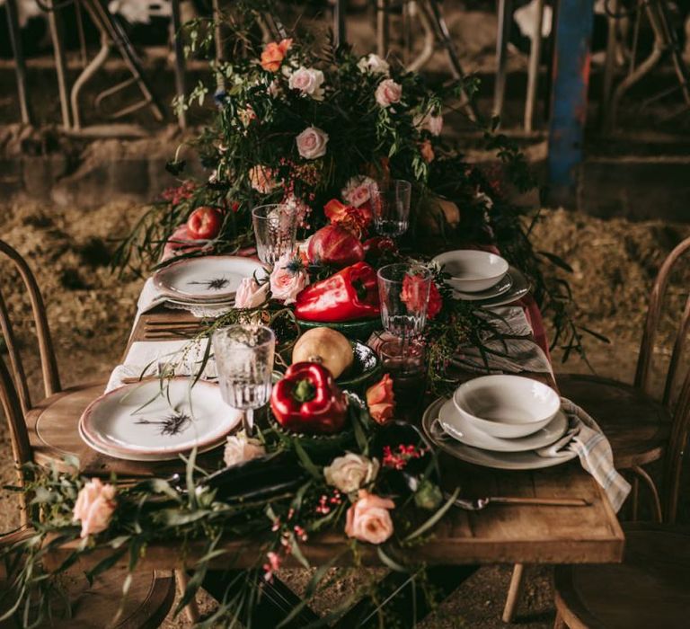 Intimate tablescape with flowers, fruits and vegetables