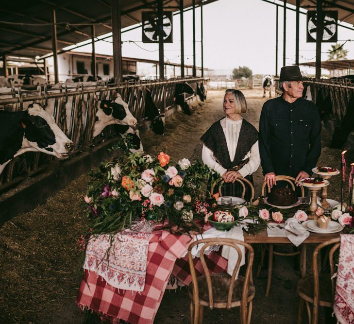 Couple portrait in front of the dessert table