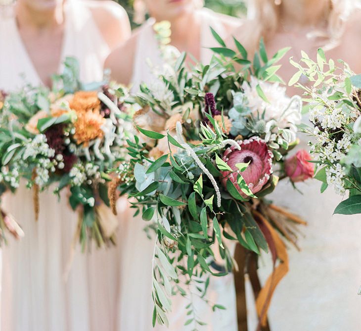 Protea Wedding Bouquets // Macrame Ceremony Backdrop Rustic Hippie Wedding The Great Barn Dream Catchers And Oversized Florals Bride In Essence Of Australia Images Kathryn Hopkins