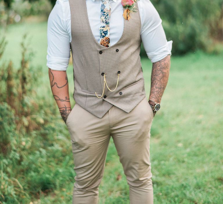 Groom in Chinos With double breasted waistcoat and floral tie // Macrame Ceremony Backdrop Rustic Hippie Wedding The Great Barn Dream Catchers And Oversized Florals Bride In Essence Of Australia Images Kathryn Hopkins