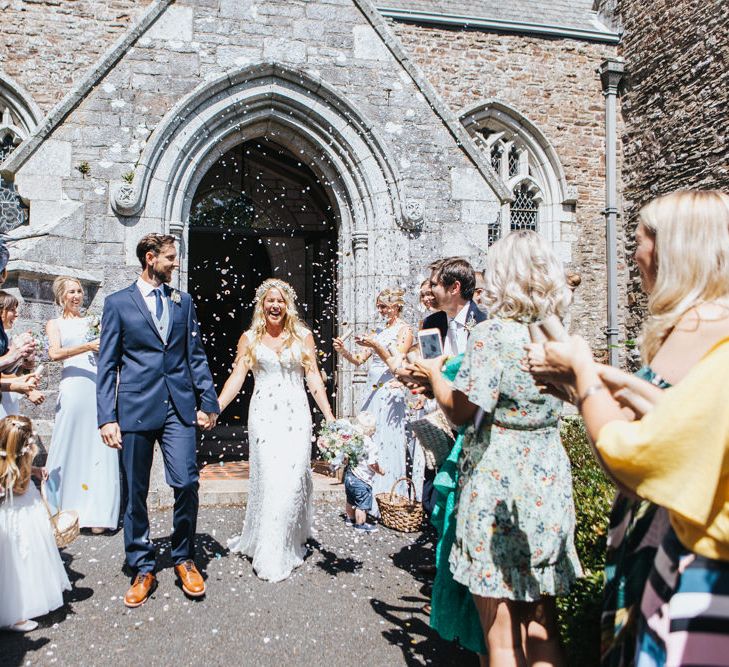 Confetti Exit with Bride in Sophia Tolli Galene Wedding Dress and Groom in Navy Blue Ted Baker Suit