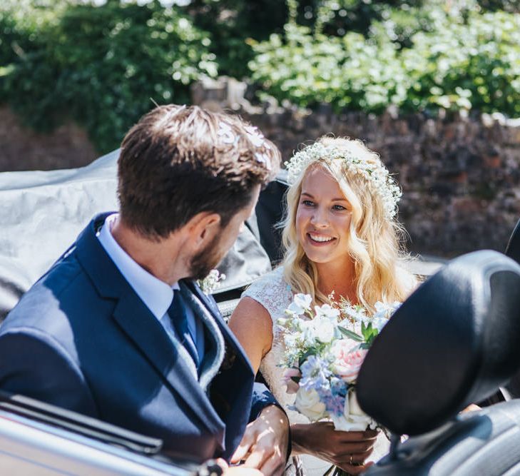 Bride in Sophia Tolli Galene Wedding Dress and Groom in Navy Blue Ted Baker Suit Sitting in Convertible VW Beetle Wedding Car