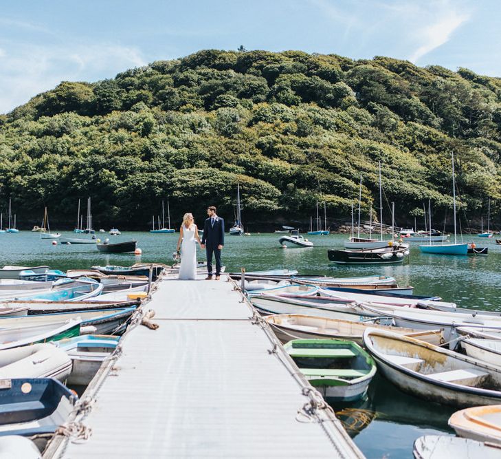 Bride in Sophia Tolli Galene Wedding Dress and Groom in Navy Blue Ted Baker Suit Portrait on the Dock