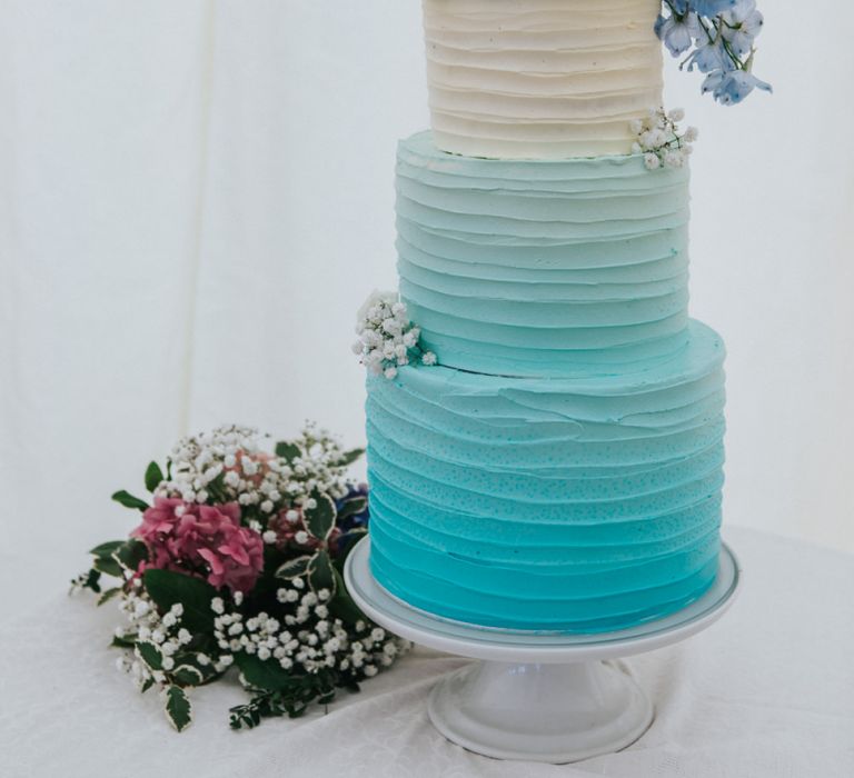 Blue and White Ombre Wedding Cake with Floral Cake Topper