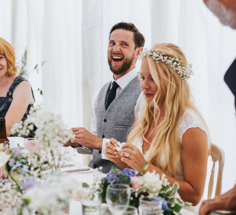 Bride and Groom Laughing at Marquee Wedding Reception