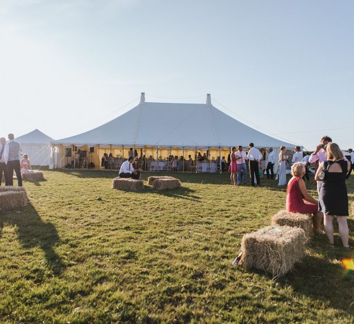 Stretch Tent Wedding Reception at Carswell Weddings in Devon with Outdoor Hay Bale Seating Area