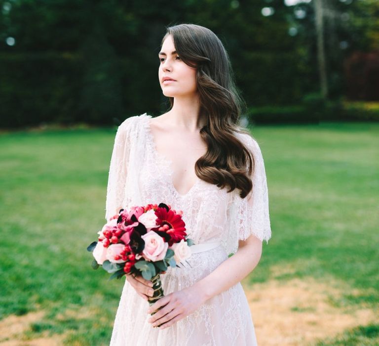 Bride in Lace Wedding Dress with Finger Waves and Red Wedding Bouquet