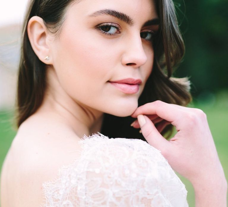 Bride with Natural Makeup Wearing a Lace Wedding Dress