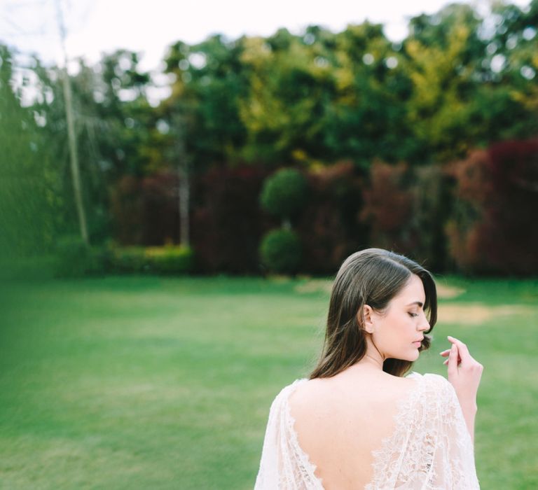 Bride in Lace Wedding Dress and Low V Back