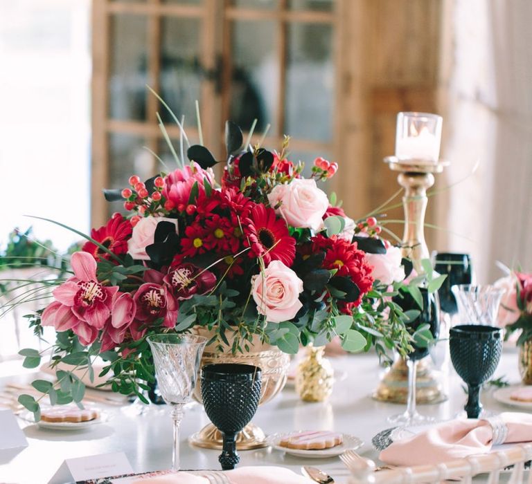 Red Flower Centrepiece in a Gold Vessel