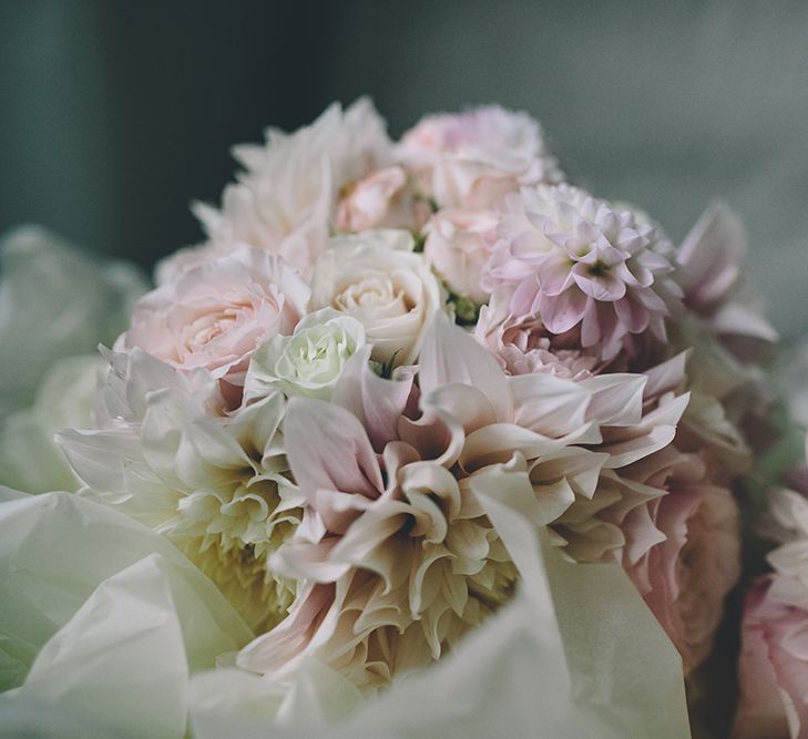 A Quintessentially British Venue at Cambridge Cottage, Royal Botanic Gardens Kew. Bride Wears Paloma Blanca from Pure Couture Bridal and Groom Wears Tailored Suit from Hackett London.