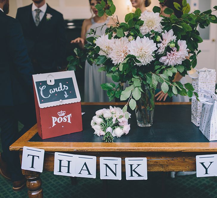 A Quintessentially British Venue at Cambridge Cottage, Royal Botanic Gardens Kew. Bride Wears Paloma Blanca from Pure Couture Bridal and Groom Wears Tailored Suit from Hackett London.