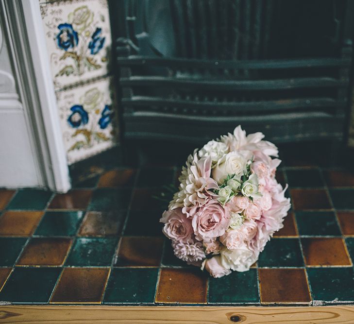 A Quintessentially British Venue at Cambridge Cottage, Royal Botanic Gardens Kew. Bride Wears Paloma Blanca from Pure Couture Bridal and Groom Wears Tailored Suit from Hackett London.