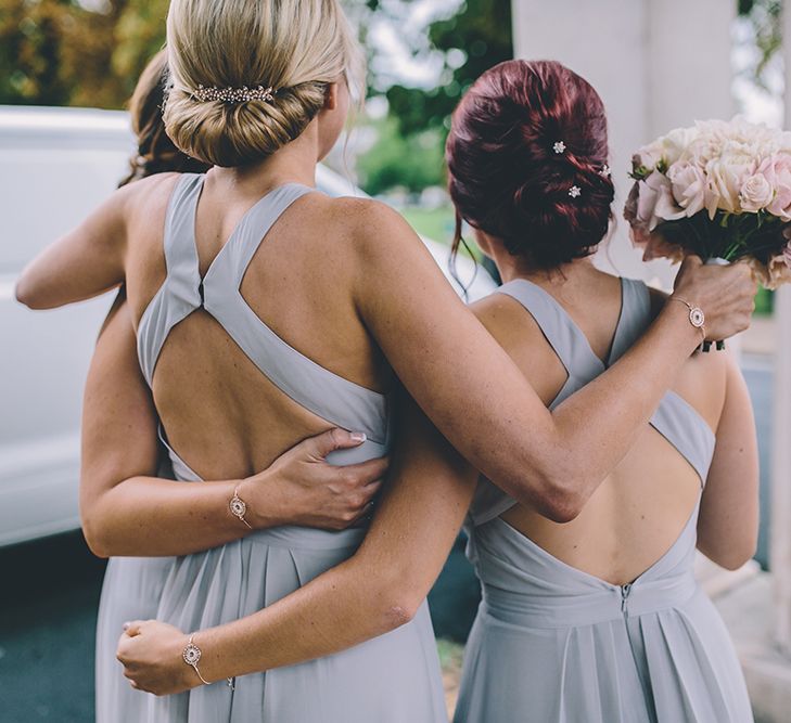 Bridesmaids Warehouse Dresses from ASOS. A Quintessentially British Venue at Cambridge Cottage, Royal Botanic Gardens Kew. Bride Wears Paloma Blanca from Pure Couture Bridal and Groom Wears Tailored Suit from Hackett London.