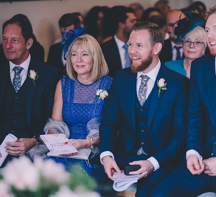 Civil Ceremony. A Quintessentially British Venue at Cambridge Cottage, Royal Botanic Gardens Kew. Bride Wears Paloma Blanca from Pure Couture Bridal and Groom Wears Tailored Suit from Hackett London.