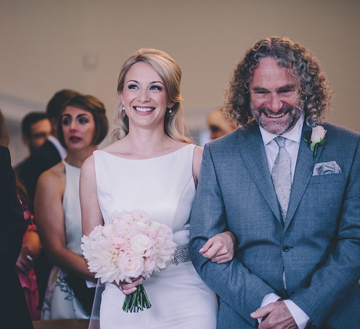 Civil Ceremony. A Quintessentially British Venue at Cambridge Cottage, Royal Botanic Gardens Kew. Bride Wears Paloma Blanca from Pure Couture Bridal and Groom Wears Tailored Suit from Hackett London.