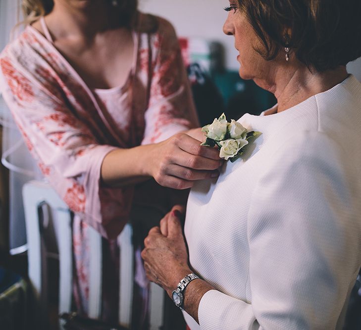 Bride’s Morning Preparations. A Quintessentially British Venue at Cambridge Cottage, Royal Botanic Gardens Kew. Bride Wears Paloma Blanca from Pure Couture Bridal and Groom Wears Tailored Suit from Hackett London.