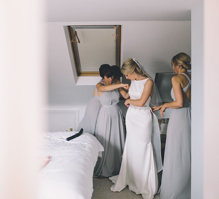 Bride’s Morning Preparations. A Quintessentially British Venue at Cambridge Cottage, Royal Botanic Gardens Kew. Bride Wears Paloma Blanca from Pure Couture Bridal and Groom Wears Tailored Suit from Hackett London.