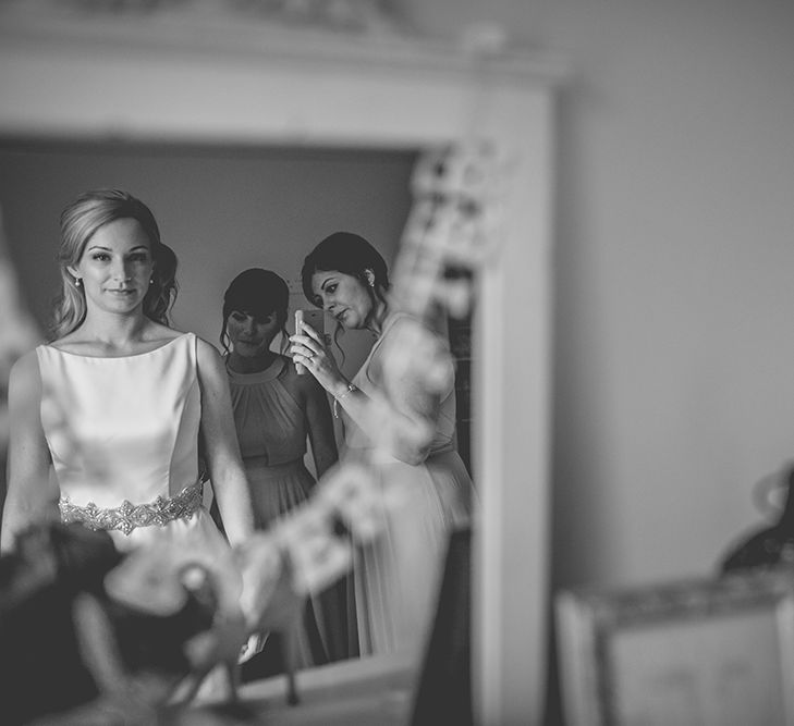 Bride’s Morning Preparations. A Quintessentially British Venue at Cambridge Cottage, Royal Botanic Gardens Kew. Bride Wears Paloma Blanca from Pure Couture Bridal and Groom Wears Tailored Suit from Hackett London.