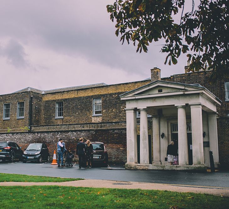 A Quintessentially British Venue at Cambridge Cottage, Royal Botanic Gardens Kew. Bride Wears Paloma Blanca from Pure Couture Bridal and Groom Wears Tailored Suit from Hackett London.