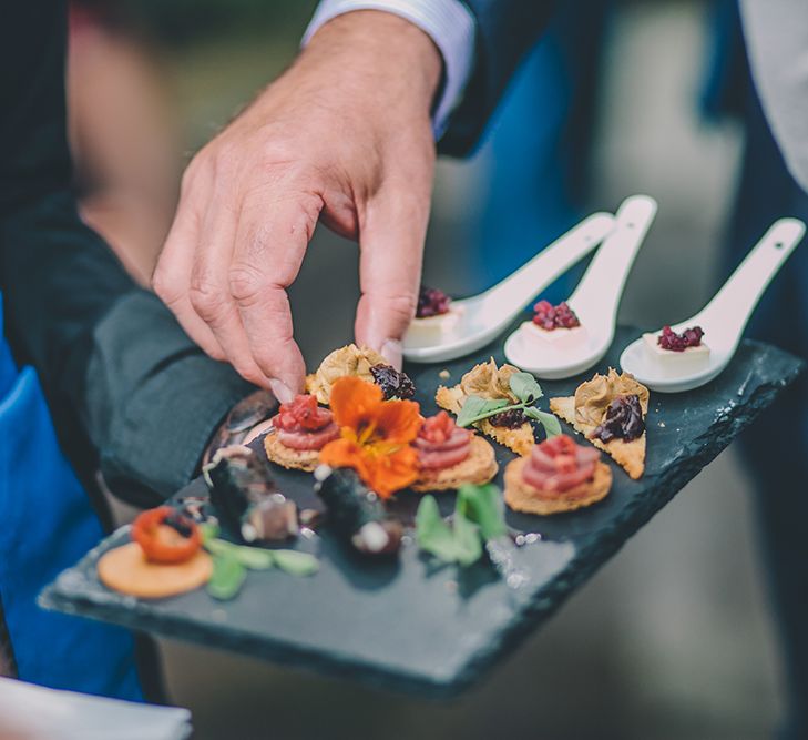 Catering by Richmond Creative. A Quintessentially British Venue at Cambridge Cottage, Royal Botanic Gardens Kew. Bride Wears Paloma Blanca from Pure Couture Bridal and Groom Wears Tailored Suit from Hackett London.