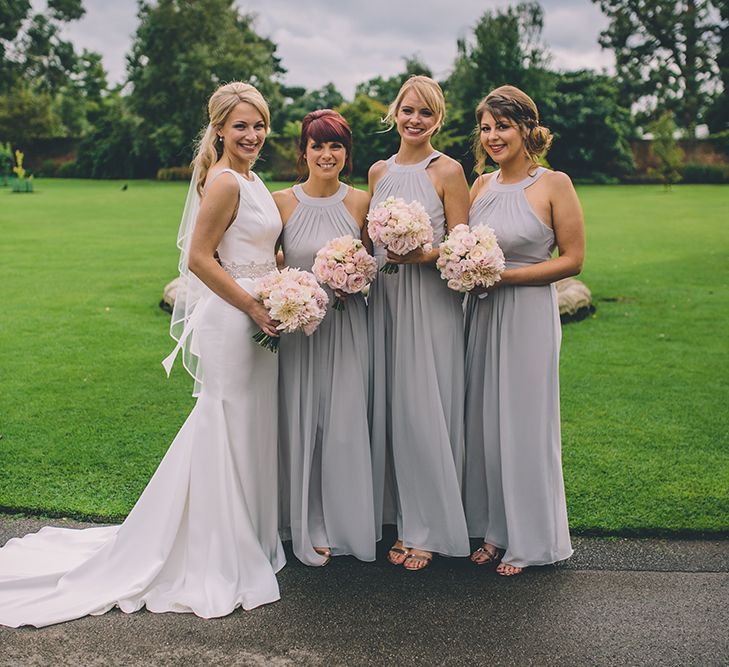 Bridesmaids Warehouse Dresses from ASOS. A Quintessentially British Venue at Cambridge Cottage, Royal Botanic Gardens Kew. Bride Wears Paloma Blanca from Pure Couture Bridal and Groom Wears Tailored Suit from Hackett London.