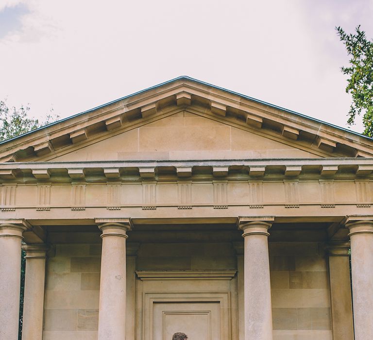 The Bride and Groom Share Some Time Together. A Quintessentially British Venue at Cambridge Cottage, Royal Botanic Gardens Kew. Bride Wears Paloma Blanca from Pure Couture Bridal and Groom Wears Tailored Suit from Hackett London.