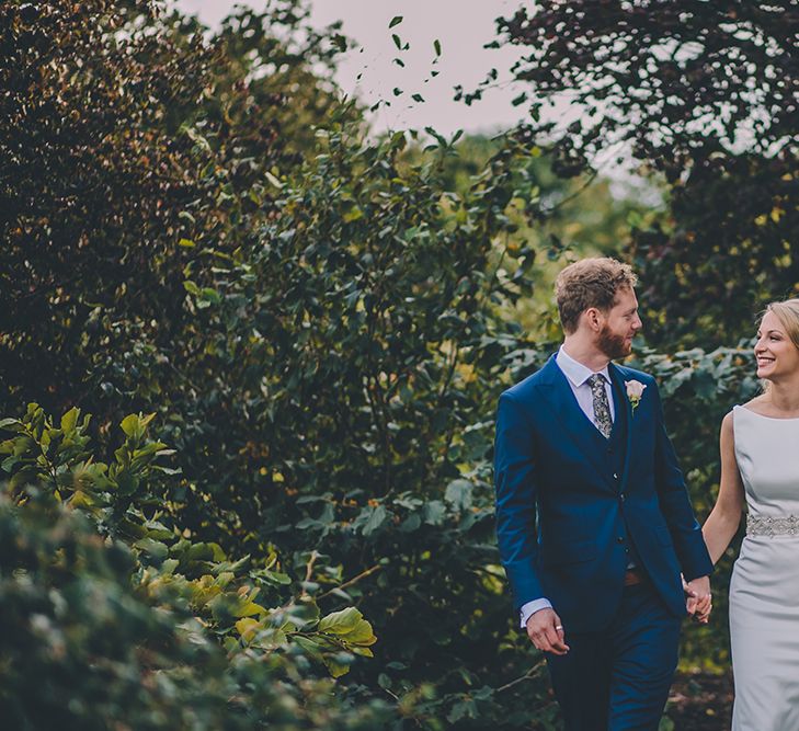 The Bride and Groom Share Some Time Together. A Quintessentially British Venue at Cambridge Cottage, Royal Botanic Gardens Kew. Bride Wears Paloma Blanca from Pure Couture Bridal and Groom Wears Tailored Suit from Hackett London.