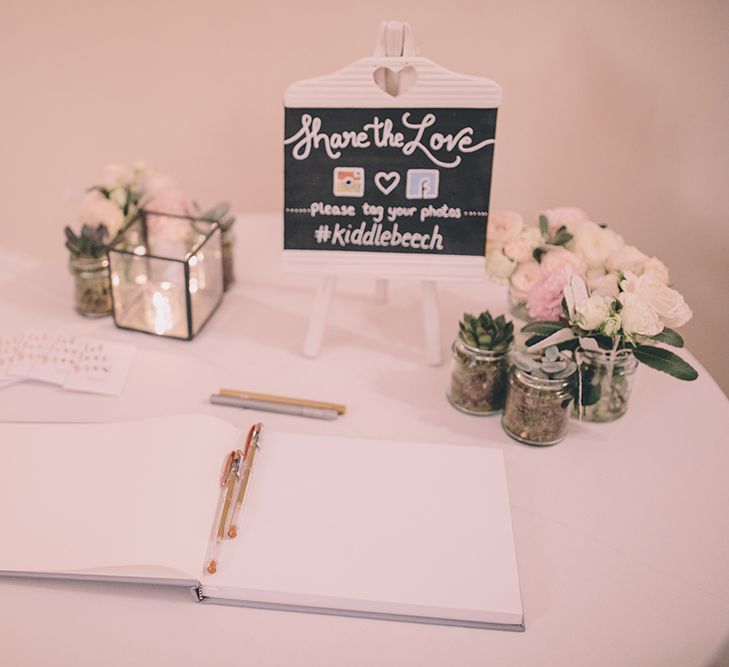 Guestbook. A Quintessentially British Venue at Cambridge Cottage, Royal Botanic Gardens Kew. Bride Wears Paloma Blanca from Pure Couture Bridal and Groom Wears Tailored Suit from Hackett London.