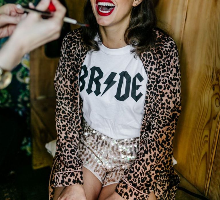 Wedding Morning Bridal Preparations with Bride in AC/DC T-shirt, Sequin Shorts and Leopard Print Robe