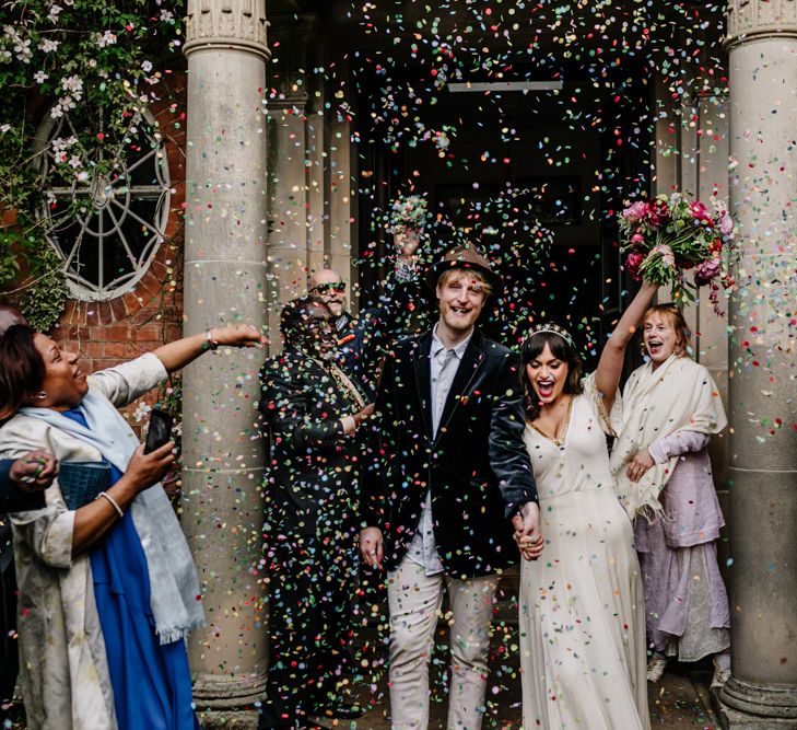 Confetti Exit with Bride in Vintage Wedding Dress and Groom in Velvet Blazer